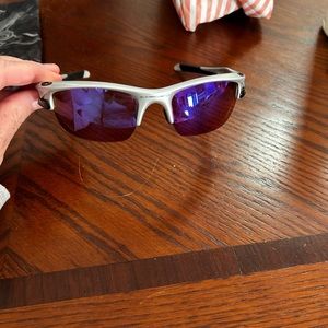 Oakley sunglasses. Worn twice. Comes with spare lenses, case, and travel case.